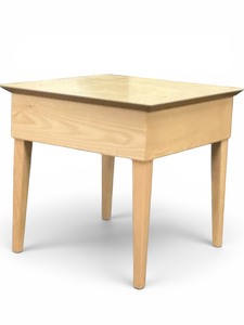 light wood accent table with tapered legs and a minimalist design