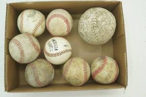 Baseballs and 1 Softball