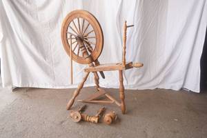 antique wooden spinning wheel