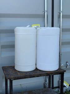 2 15 gallon empty plastic barrels