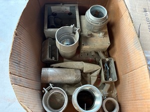 Assorted Electrical Conduit Fittings and building safety signs