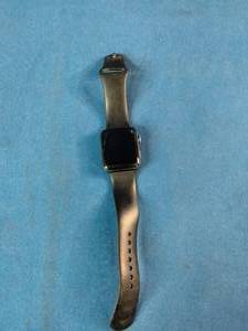 Apple Watch, likely a Series 3 or similar model, featuring a black band.