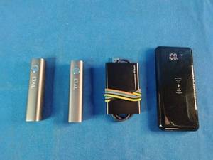 Collection of portable electronics, primarily consisting of portable power banks and charging devices.