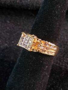 Yellow gold colored multi-row cluster ring featuring a distinctive square or grid-patterned center head. Size 7.25