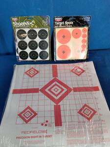 A collection of shooting range accessories designed for firearm target practice and optic zeroing.