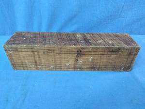 Raw Olivewood blank often used for woodworking projects like knife handles or turning stock.
