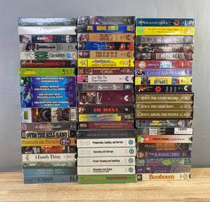 60 VHS Movie Collection - Golden Eye, Raiders of the Lost Ark, Flintstones, Beethoven, In Hell, Beavis and Butthead C