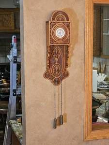 Ornately Carved Wooden Wall Clock with Chain Weights