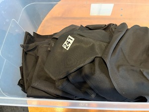 Tub of black cloth napkins