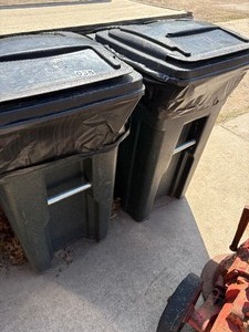 Pair of garbage cans on wheels