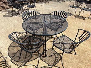 Round black mesh metal table and chairs