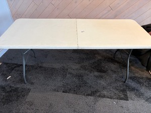 Foldable white plastic table