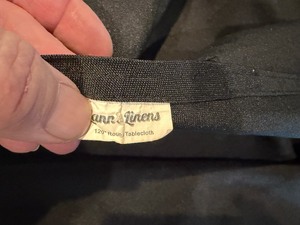 Pile of black linens for banquet rounds