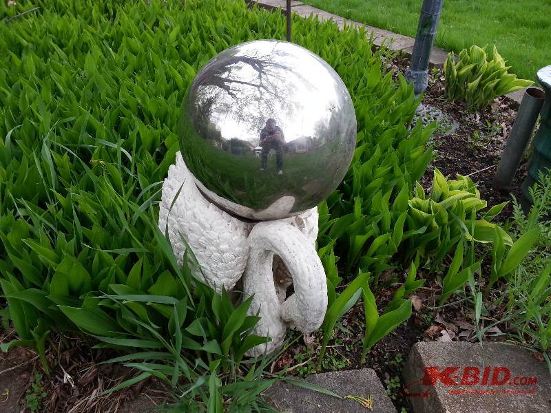 Mirror Sphere Gazing Ball on top of a Swan