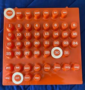 1970s Ring-A-Date Perpetual Wall Calendar Orange Plastic MCM Mod Decor