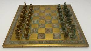 Est. $400.00- $600.00 14" x 14" Vintage Greek Brutalist Bronze Chess Set With Matching Brass Board