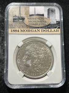 1884 US MORGAN SILVER DOLLAR SLABBED