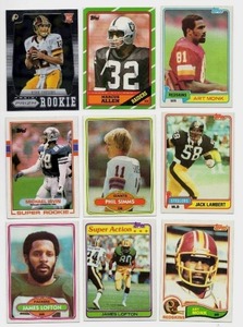 Lot Of 9 Football Cards Including 1989 Topps Michael Irvin #383 Rookie Card, 1980 Topps #225 Phill Simms Rookie Card, and More