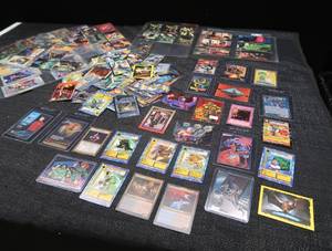 LARGE LOT OF COLLECTABLE POKEMON,  STAR TREK,  AND YUGIOH TRADING CARDS