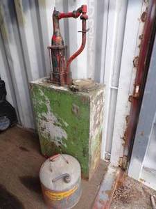 Vintage Oil Storage Container with pump and 5 Gallon Eagle Gas Can