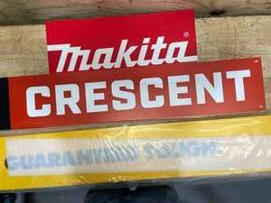 Makita, Crescent, and  Guaranteed Tough  DeWalt signs