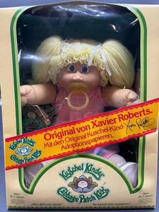 Cabbage Patch Kid - Arxon - German - Pigtail - Lemon Hair - Blue Eyes - Dimples and Pacifier - Girl - MIB