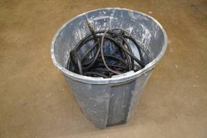 Garbage Bin with Air Hoses and Extension Cords