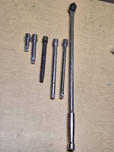 Breaker bar and socket extensions set including various lengths and sizes