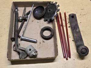 Assorted Metal Parts and Tools including Piston, Gear, and Crank Arm