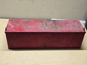 Red Metal Tractor Tool Box with Warning Label