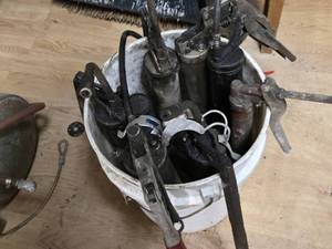 Lot of Grease Guns in a Bucke