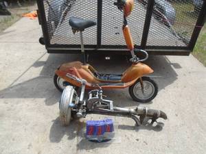 Champion outboard vintage Champion outboard motor & electric scooter. As shown.