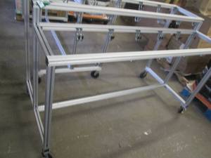 Metal rack on wheels with hooks, me...