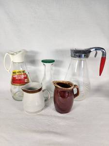 Glass and Ceramic Pitchers including Log Cabin Syrup Pitcher, Hull Pottery Creamer, and Stoneware Japan Creamer