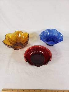Amber, blue, and red decorative glass bowls