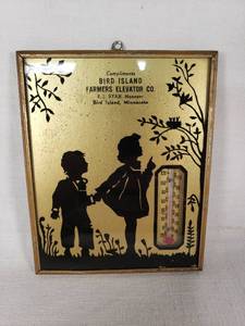 Bird Island Farmers Elevator Co. Wall Thermometer features a silhouette design of children and foliage