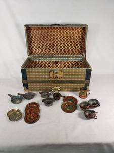 Vintage Tin Toy Tea Set with Decorative Plates and Cups, Stored in a Patterned Trunk