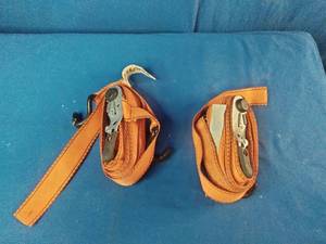 2 Good Year Orange tie-down straps feature heavy-duty metal ratchets for securing cargo. 1100 Pound Rating