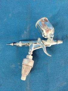 K-3 mini air spray paint gun used for detailed finishing projects.