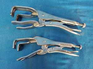 Mac Tools U-shaped locking welding clamps, designed for holding metal panels in place.
