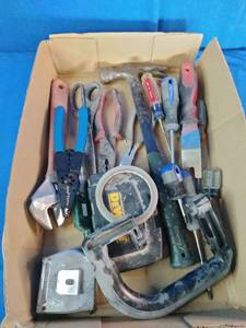 Variety of essential hand tools commonly used for household repairs, carpentry, and electrical work.
