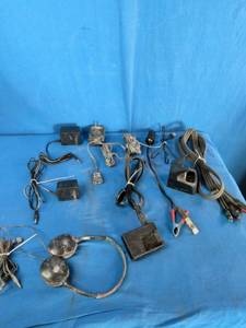 Bulk lot of various electronic accessories, including power adapters, charging cables, and audiovideo cables.