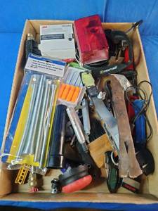 This box contains a variety of miscellaneous hand tools and hardware