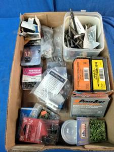 Assortment of fasteners, hardware, and workshop supplies.