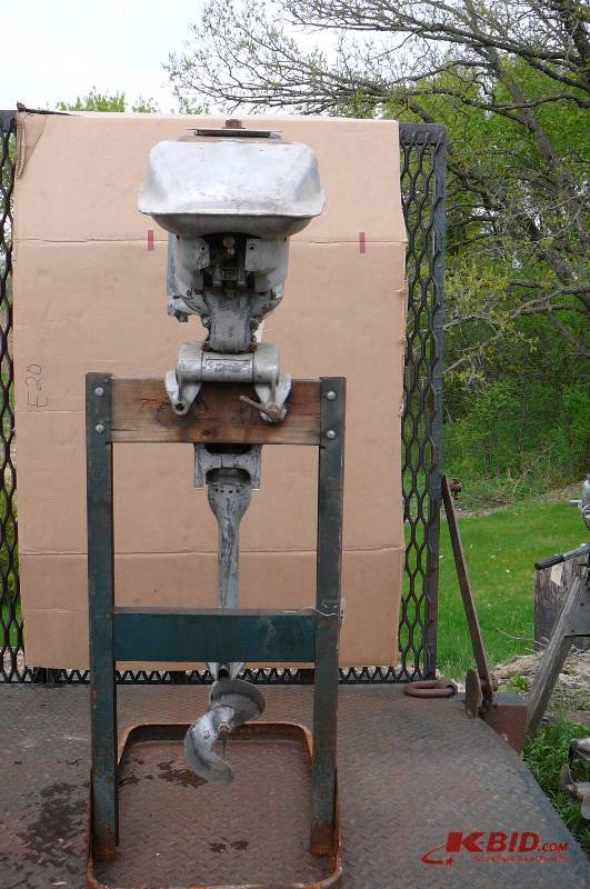 lot 193 image: Vintage out board motor Champion Stuck