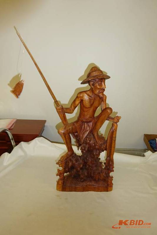 Wood man fishing statue