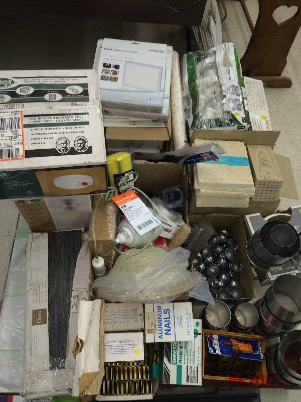 pallet of tile,fence post caps, door knobs, plumbing , filters staple gun staples ,lights,lamp ,misc