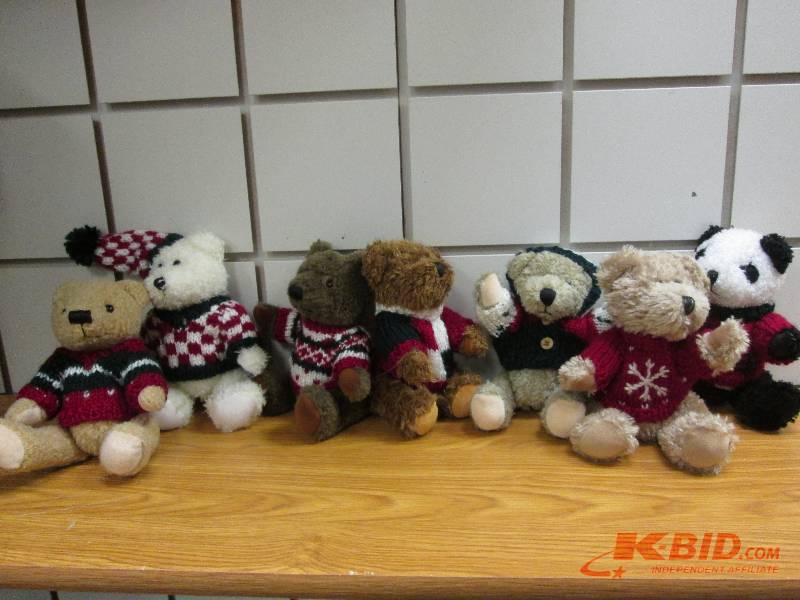 lot 215 image: small bears dressed in sweaters...
