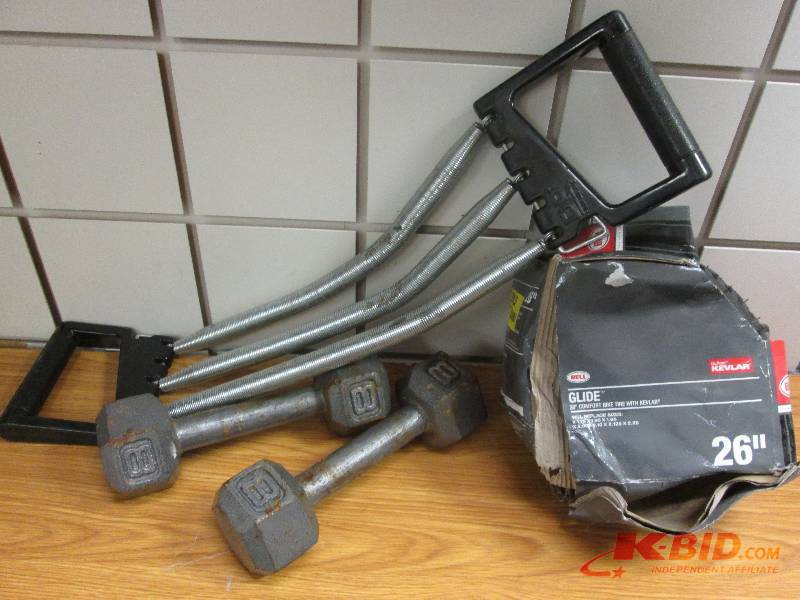 lot 245 image: 8 pound weights, 26 inch bike tire,...