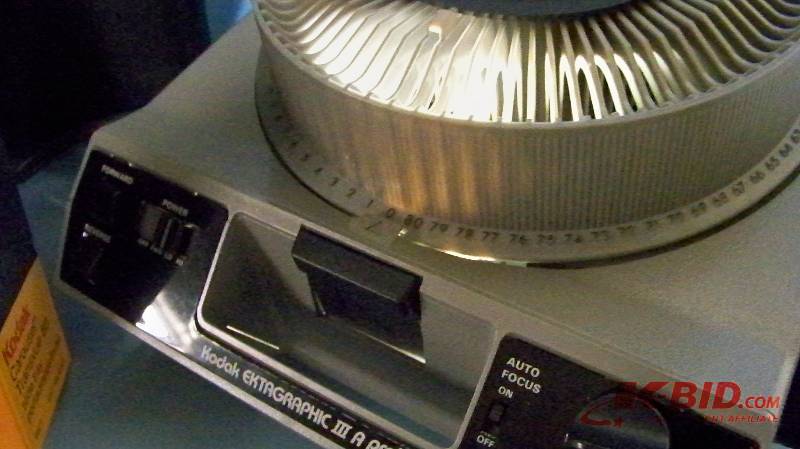 lot 90 image: Kodak, Slide Projector with Slide Carousel, Remote Control and Travel Case